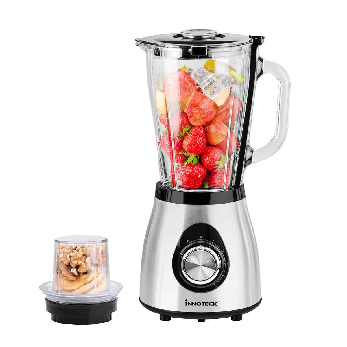 Blender with strawberries and a container of nuts on a white background