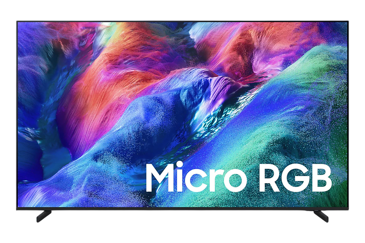 A modern flat-screen TV on a white background, displaying a colorful canyon scene with the text 'Micro RGB' overlaid in white. The TV has a thin black frame and small black stand legs.