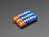 Alkaline batteries in various sizes, providing long-lasting power for household devices like remotes, toys, and flashlights.