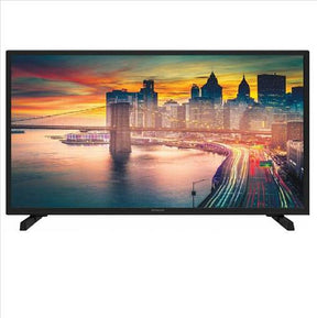 A black flat-screen television displaying a vibrant city skyline and bridge scene at sunset, shown against a plain white background.