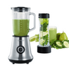 Blender with green smoothie and additional container with ingredients on a white background