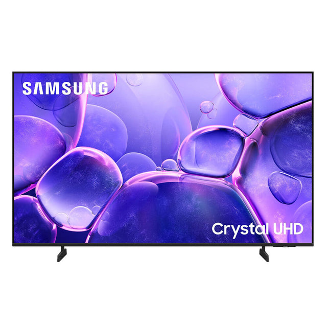 Samsung Crystal UHD television with a thin black frame, supported by two black stand legs, shown against a plain white background. The screen displays a purple and blue abstract bubble pattern with the SAMSUNG brand logo in the top-left corner and 'Crystal UHD' text in the bottom-right corner.