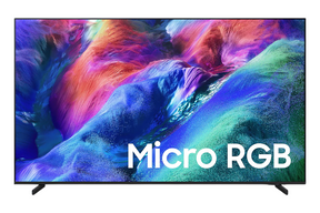 A modern flat-screen TV on a white background, displaying a colorful canyon scene with the text 'Micro RGB' overlaid in white. The TV has a thin black frame and small black stand legs.