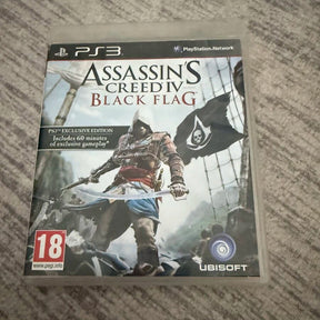 Assassin's Creed IV: Black Flag PS3 game case on a textured gray fabric surface, showing PlayStation 3 branding, Ubisoft logo, and PEGI 18 rating.