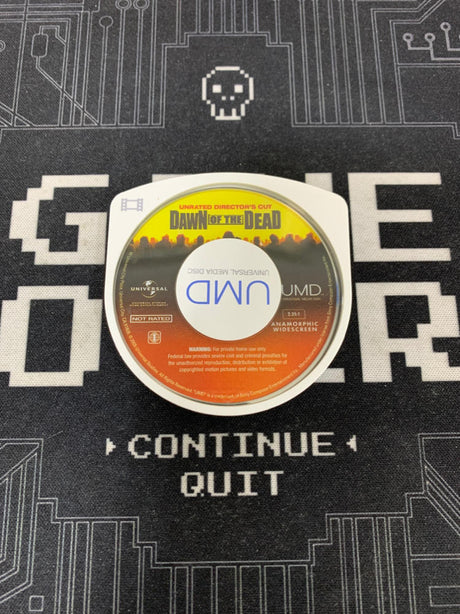 UMD disc on a textured surface with game interface text